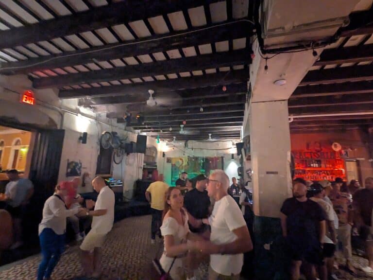 The unmarked corner building housing La Factoría bar on Calle San Sebastián in Old San Juan, Puerto Rico