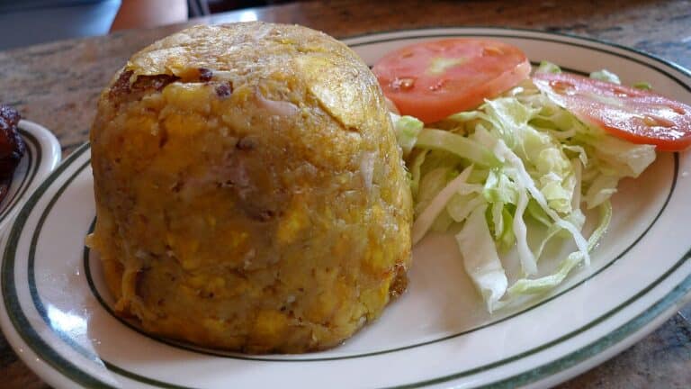 A plate of Puerto Rican mofongo made with mashed plantain and pork crackling