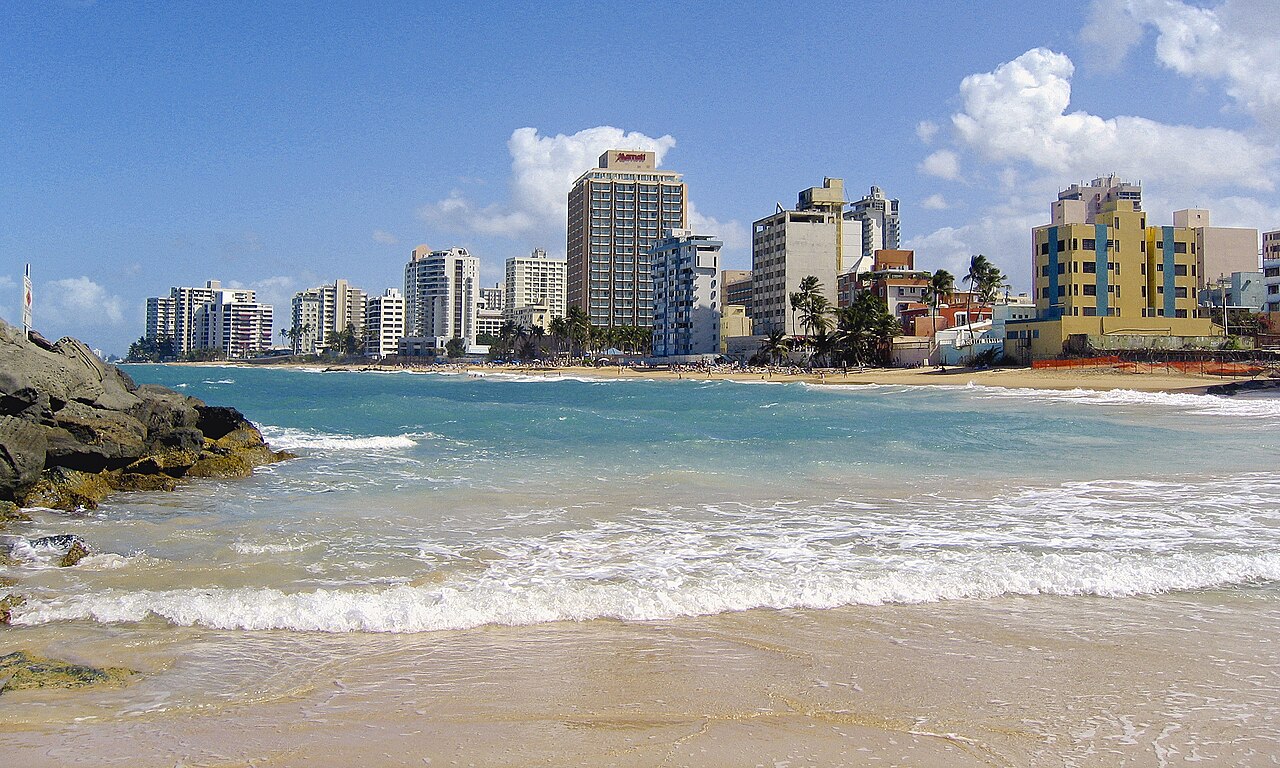 Palm trees and turquoise water along Condado Beach in San Juan, Puerto Rico