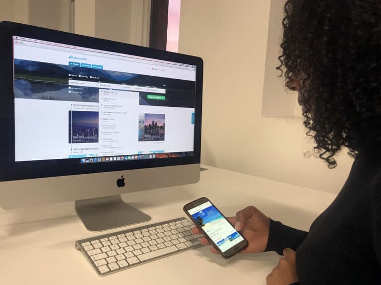 A traveler browsing a holiday booking website on a laptop